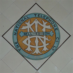 The rivalry between Bell & Edison, and the co-invention of the same device using different methods, is immortalised in the National Telephone Company crest.