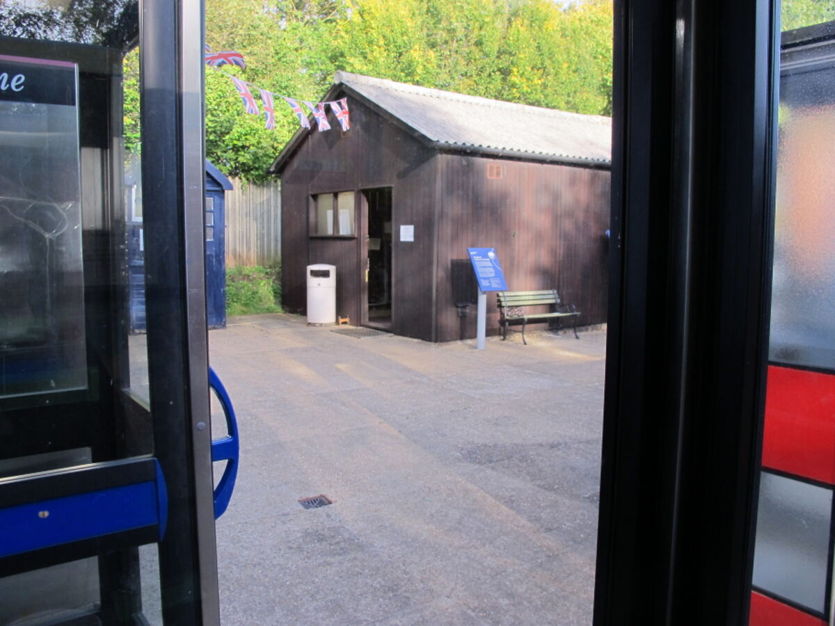 The original Stableford telephone exchange building, a wooden shed, viewed from a nearby kiosk