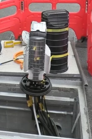 A splitter enclosure mounted on a telegraph pole.